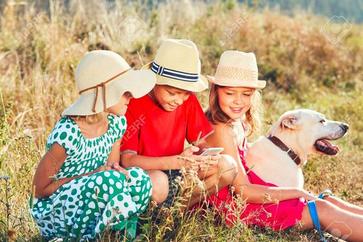 Happy children playing with smart phone. Themes friendship, summertine and modern technology Stock Photo , #spon, #smart, #phone, #Themes, #Happy, #children