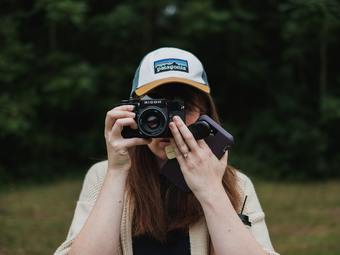 woman about to take a photo using black bridge camera photo – Free ...